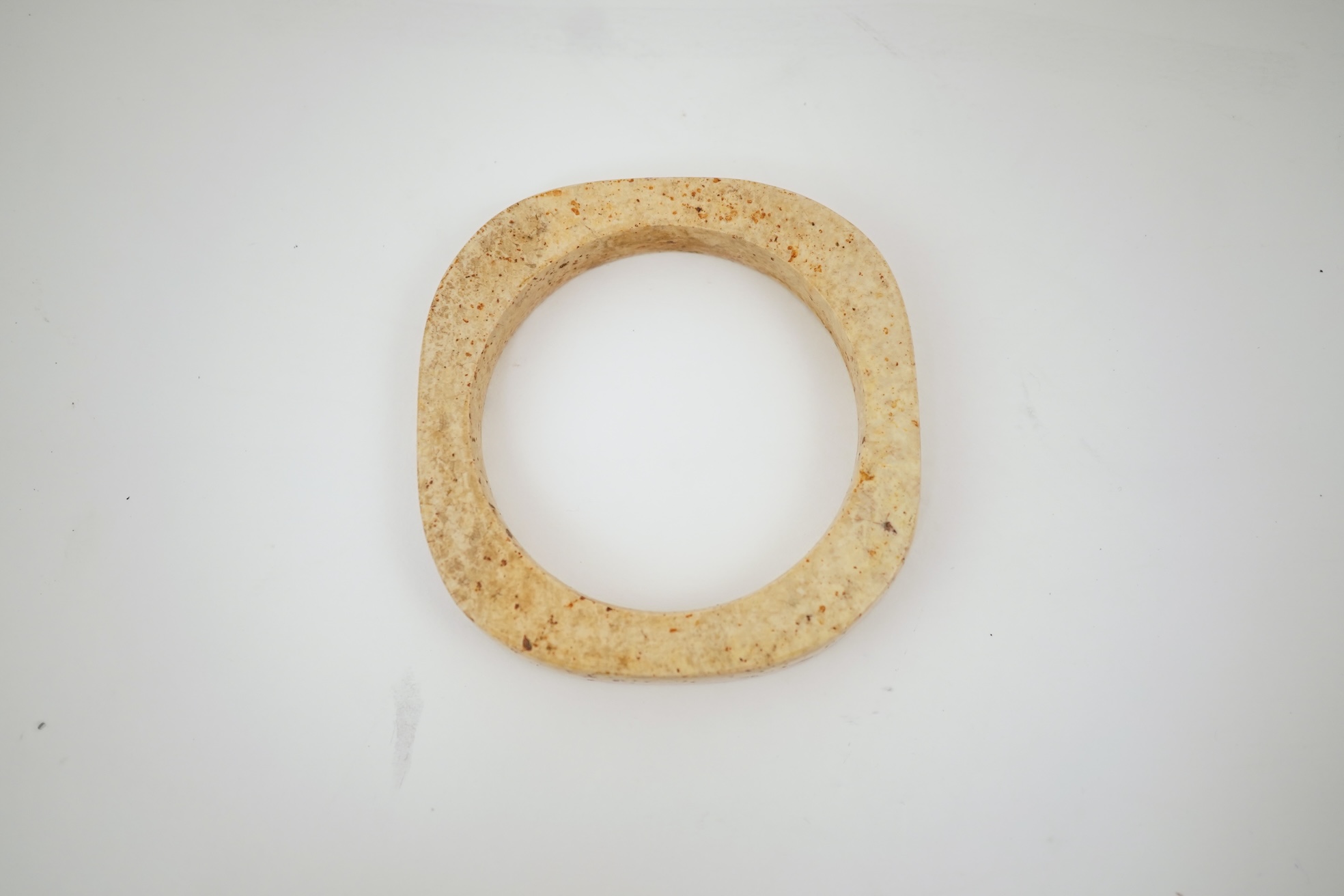 Four Chinese archaistic hardstone or burnt jade cong or cylinders